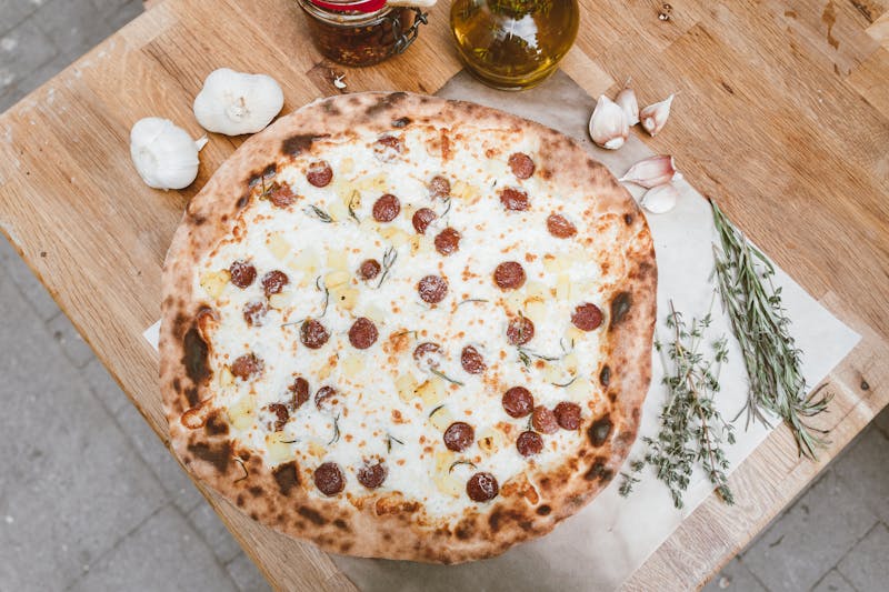 Spicy Western ranch pizza with pepperoni and ranch drizzle