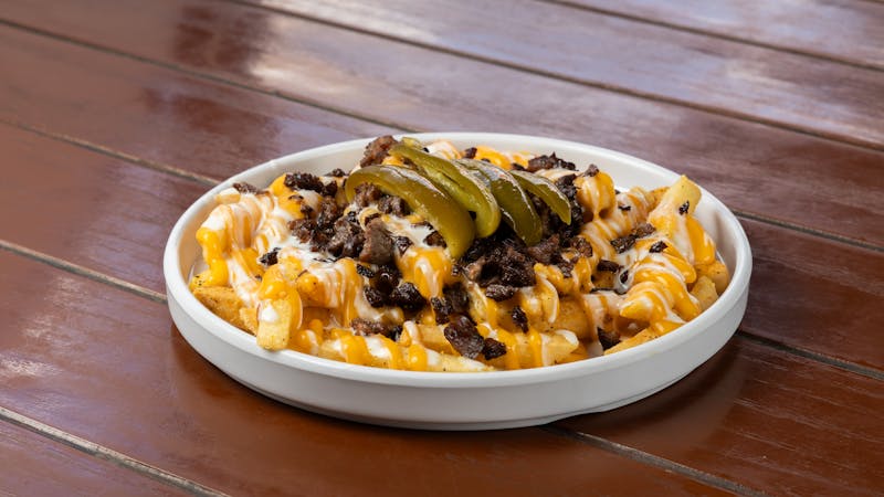 Loaded nachos with cheese and jalapeños appetizer